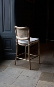 Anouk Barstool in Natural Linen with Rattan Back