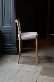 Anouk Barstool in Natural Linen with Rattan Back